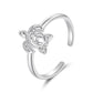 Adjustable open cuff ring with raised ocean-life motif, silver-tone, close-up angle
