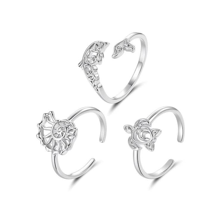 Three adjustable open cuff ocean-life rings, silver-tone, different motif angles