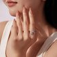 Seahorse opening ring on finger, silver tone with purple and blue zircon accents