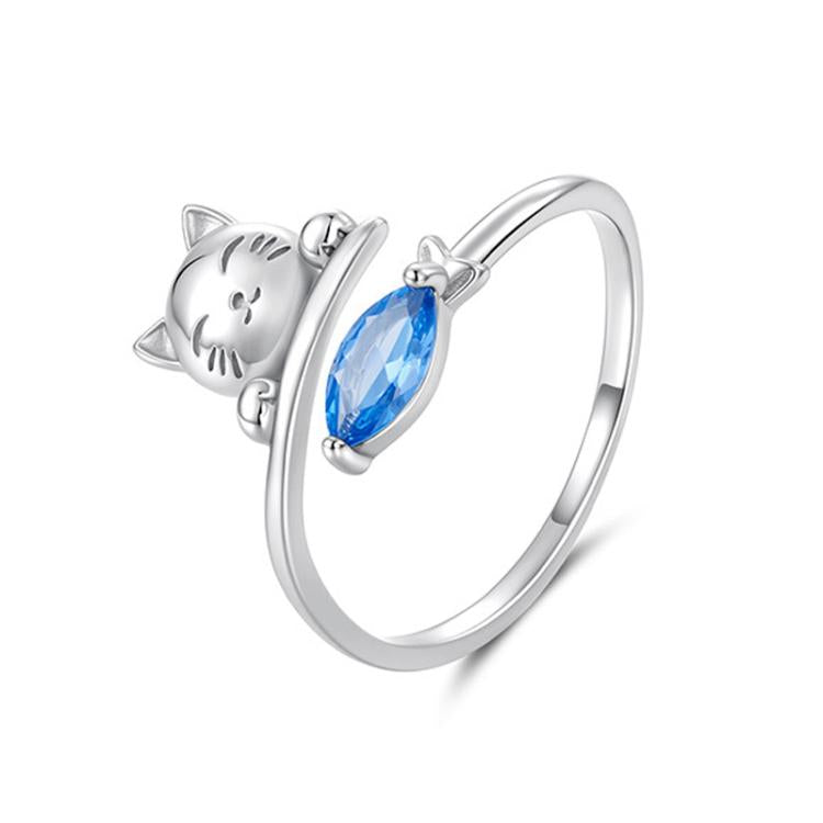 Open cat-and-fish ring with blue teardrop zircon centerpiece, silver-tone band
