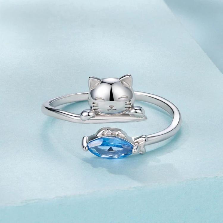 Open cat ring design with blue oval zircon stone, silver-tone band and cat details
