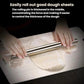 Stainless steel rolling pin rolling out dough on a metal baking surface