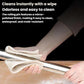Stainless steel rolling pin being wiped clean with a cloth