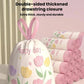 White drawstring trash bag with floral print and pink ribbon-style ties