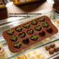 Brown silicone heart chocolate mold with heart cavities topped with green leaves