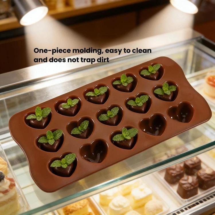 Brown silicone heart chocolate mold with heart cavities topped with green leaves