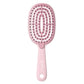 Hair massage comb with oval pin pad and pink handle, dense massage pins