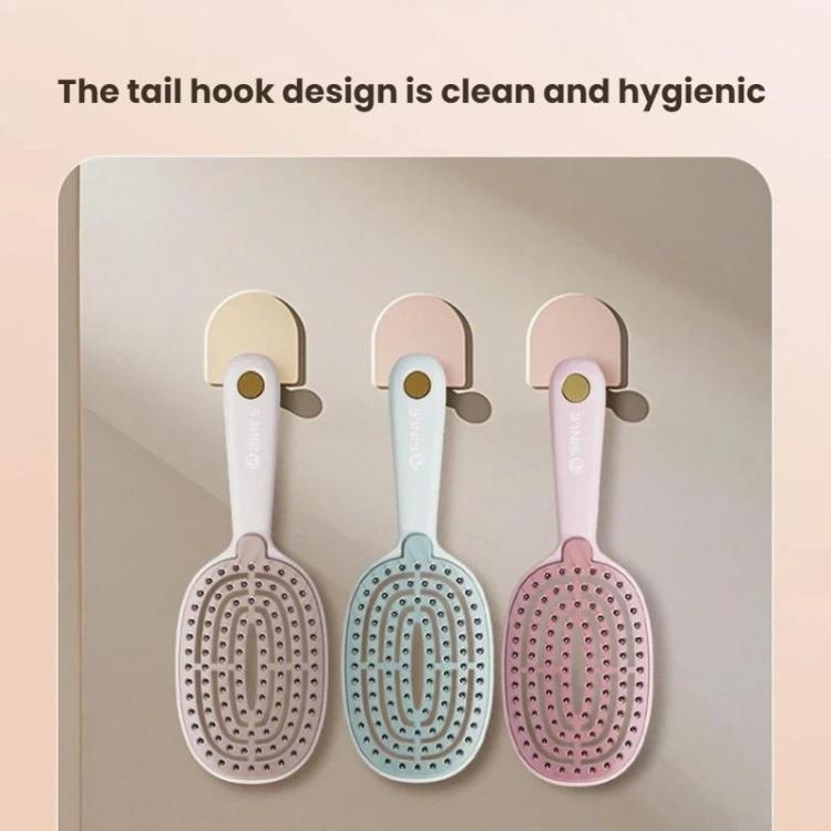 Set of three hair massage combs in white, blue, and pink hanging by hooks