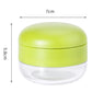 Green and clear manual garlic press, 7 cm width and 5.8 cm height.