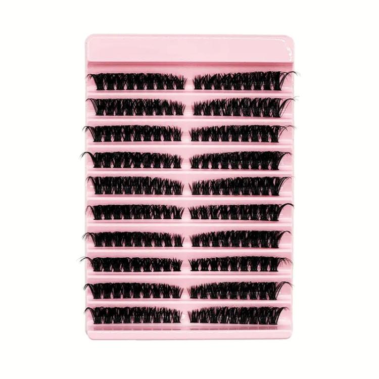 Multiple rows of curled black false lash clusters on segmented strips, pink tray
