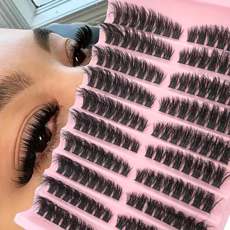 Curled dark segmented false eyelash clusters on adhesive strip, thick curled style