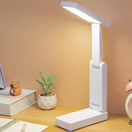 White rechargeable folding desk lamp with rectangular light bar and stable base