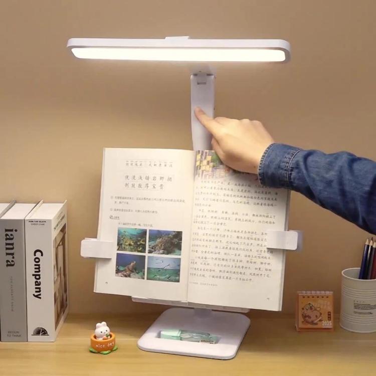 Adjustable LED desk lamp with white light bar and clamp-style book holder base