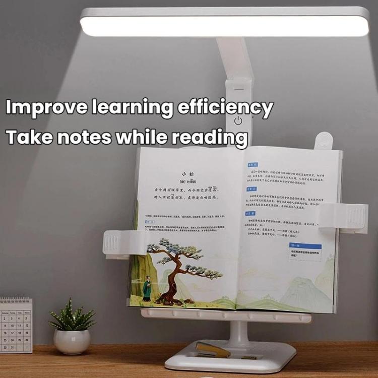 Adjustable white LED desk lamp with tall post and light bar over open book
