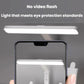 Adjustable LED desk lamp producing a bright light bar over a phone camera view