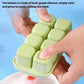 Close-up of mint-green TPE ice cube mold tray with twist-and-press release base