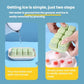 Ice cube mold tray being pressed to release; fruit ice pieces in compartments