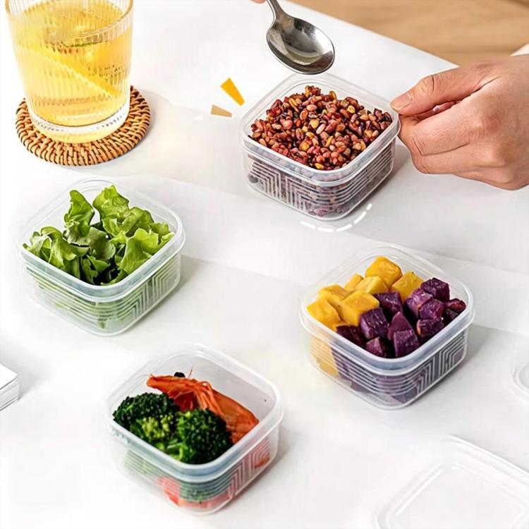 Square freezer food container with clear lid, hand holding diced food