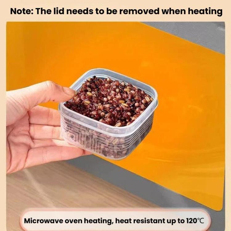 Square freezer food container with clear lid, hand holding a filled container