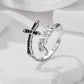 Side view of silver-tone adjustable cross ring with black stone inlay and Faith lettering