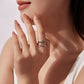 Woman wearing silver-tone adjustable cross ring with black stones and Faith lettering