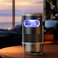 Standing mosquito killer night light on a table with purple glow and transparent base
