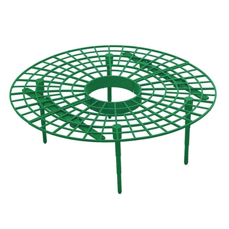 Green circular grid fruit cradle with central hole and three long legs