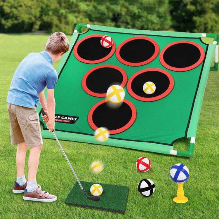 Green golf practice target mat with nine red-ring holes and balls on outdoor turf