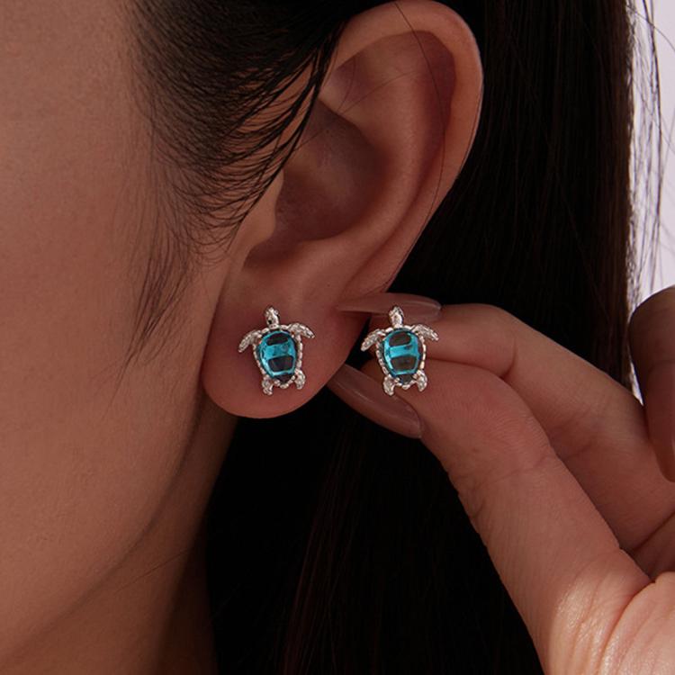 Silver-tone turtle earrings with blue oval gemstone and shell-like frame