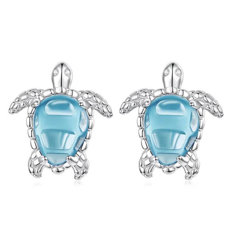 Silver-tone turtle stud earrings with blue gemstone and decorative side details