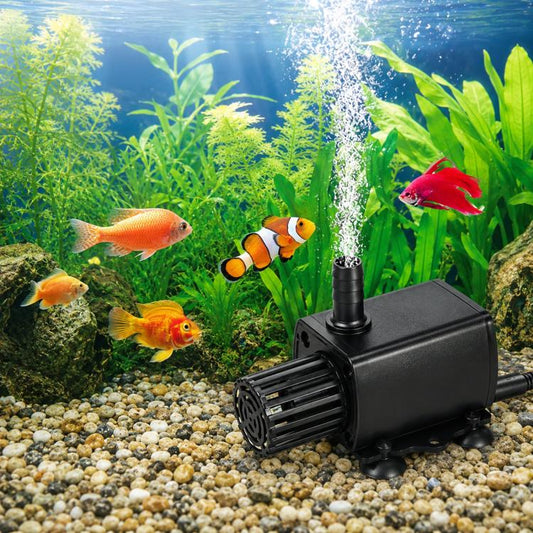 Black submersible aquarium pump on gravel with intake grille and water outlet spray