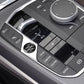 Engine start/stop button area with round “START ENGINE STOP” sticker on car center console