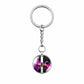 Galaxy crystal ball keychain with silver keyring and dangling chain loop.