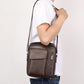 Men's vintage crossbody shoulder bag on a person, dark brown leather-look with flap pocket