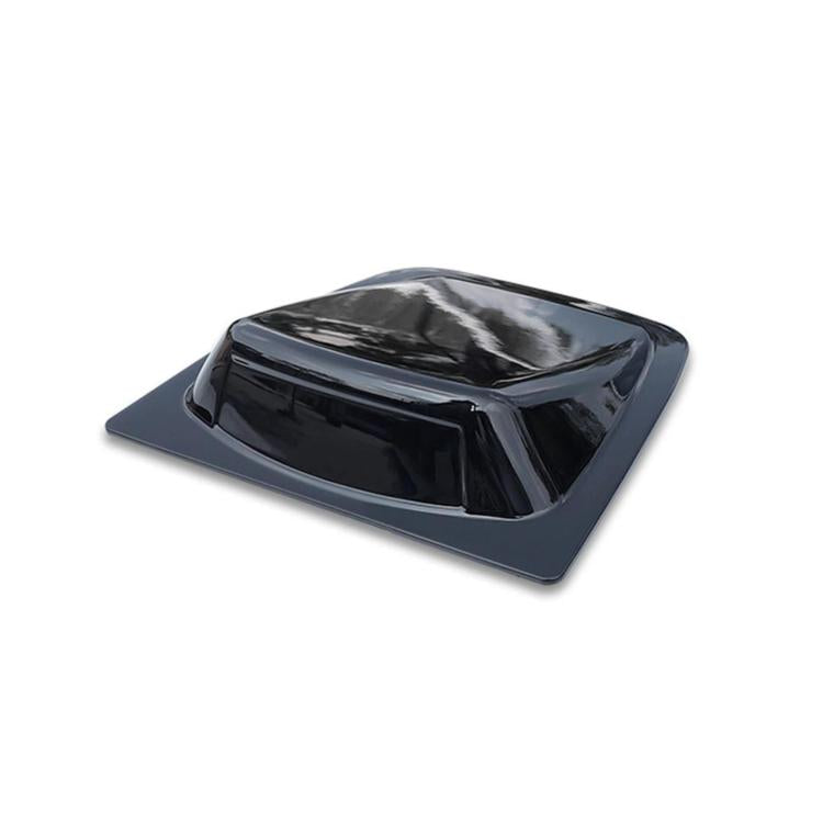 Glossy black car roof decorative cover with raised center section on dark mounting base