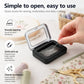 Magnetic needle storage box with clear lid, hand lifting lid over black base