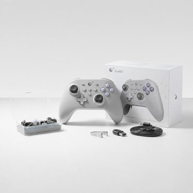 White game controller set in box with charging accessories and spare components