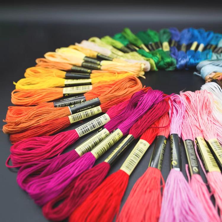 Six-strand embroidery thread skeins in orange, blue, green, pink, and more