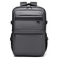 WEIXIRE B929 men’s business backpack in dark gray with front zip pockets and top handle.