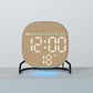 Round LED desk clock with wood grain face, glowing LED digits, temperature indicator