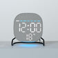 Round LED desk clock with gray fabric face, blue ambient light strip and large LED digits