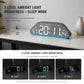 Dark gray LED desk alarm clock with blue digits and ambient light brightness