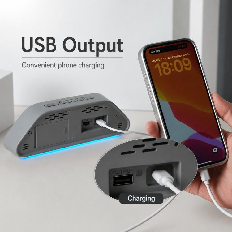 LED desk clock with USB output port, phone charging cable plugged in