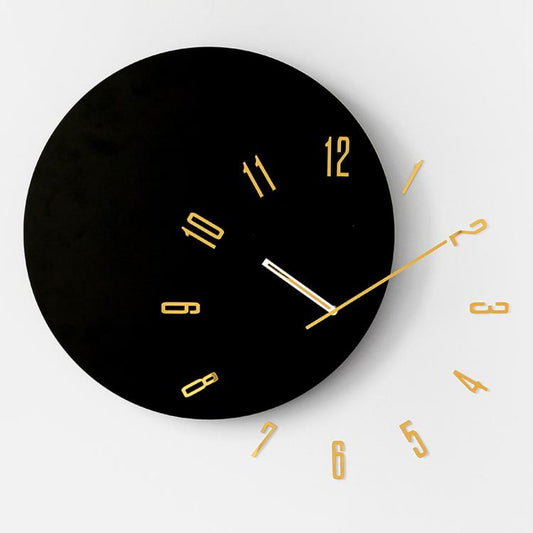 Wall clock with dark dial, gold hour markers, and gold-toned hands