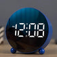 Circular LED alarm clock, black base with blue LED time digits on round display face