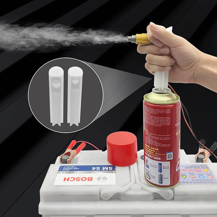 Fuel injector cleaner bottle connected to a fuel injector tester with leads and nozzle