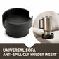 Black cup holder insert holding a stainless tumbler on a sofa armrest