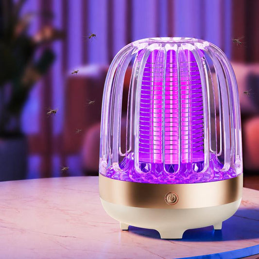 Navy blue electric mosquito killer lamp with purple UV glow, front view on table