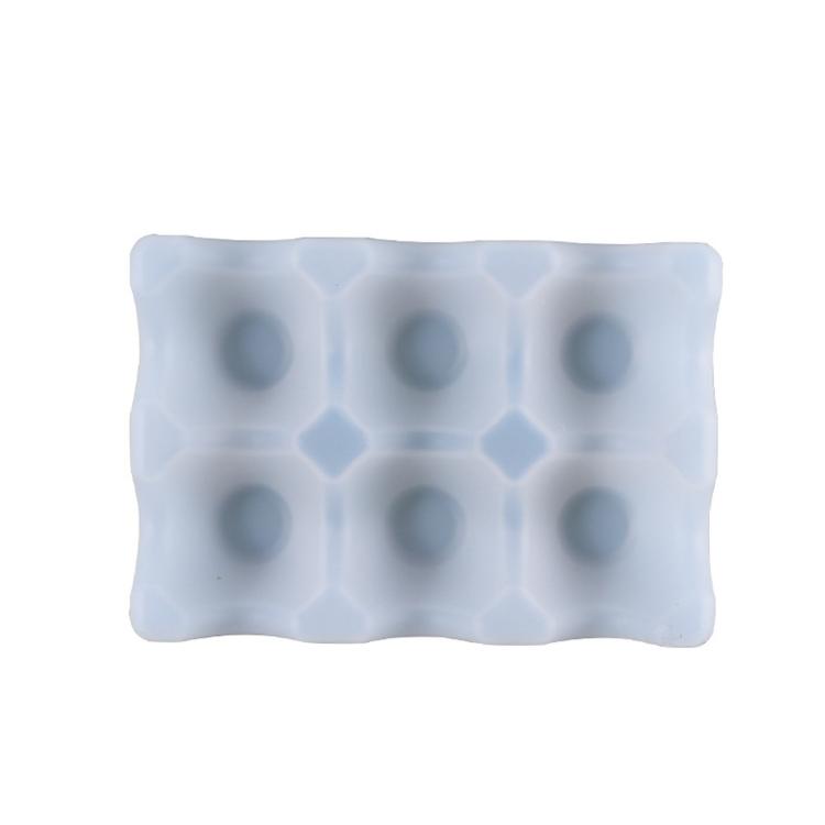 Light gray silicone egg tray mold with 6 egg-cup cavities, rectangular.