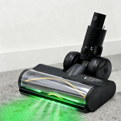 Motorized floor brush head with black housing and green dust-detecting light strip